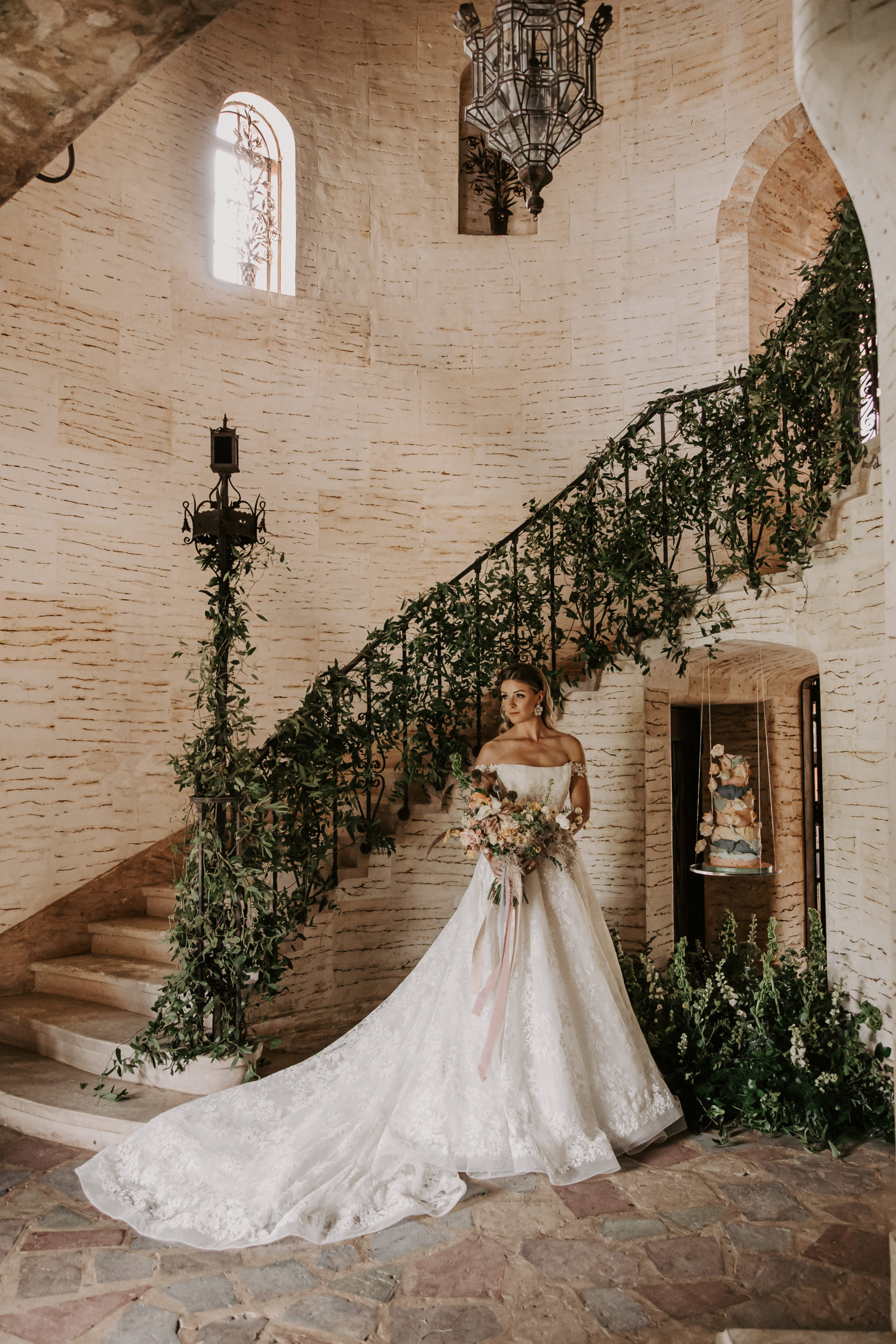 The bride looks like she is walking into a dream wearing three different gowns and right on trend from The Bridal Finery