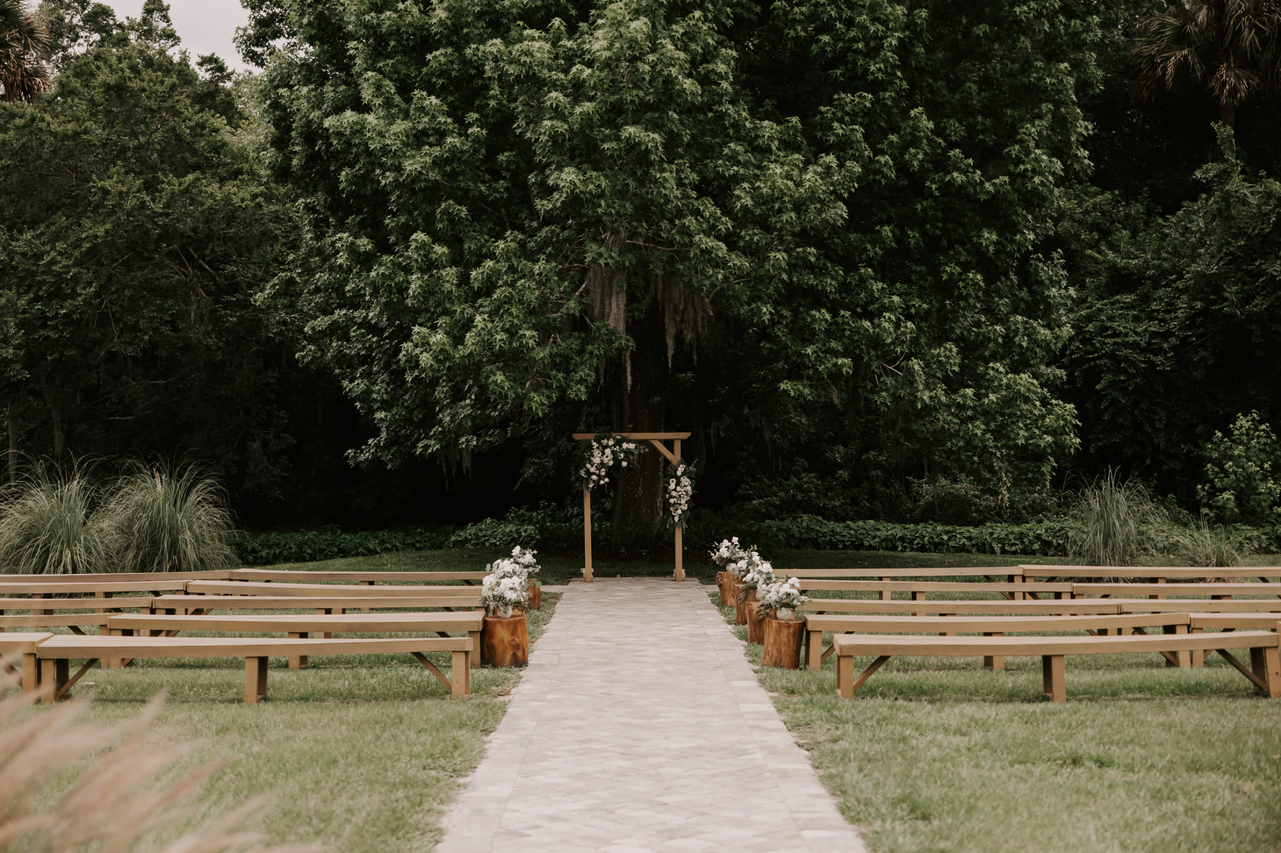 The already beautiful surroundings required very little extra decor so those white flowers enrobing their sleek ceremony arch couldn’t have been more perfect.
